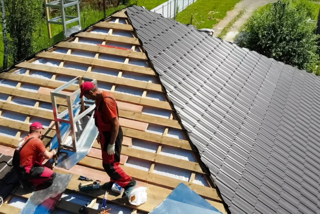 male roofing contractor working on a new roof installation project